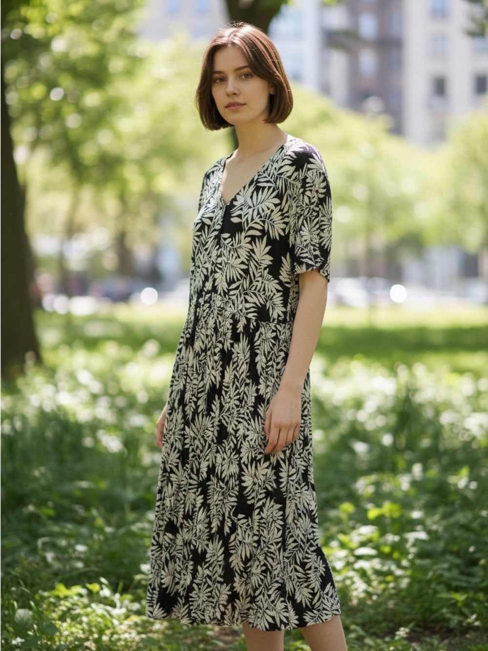 Woman Within Black Midi Dress with White Leaf Print